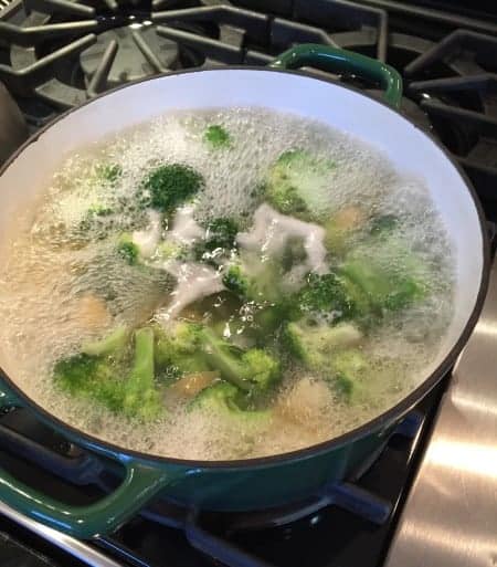 pasta and broccoli cooking on the stove