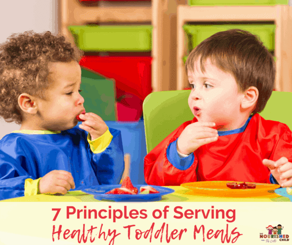 Two toddlers eating lunch together. Learn the 7 Principles of Serving Healthy Toddler Meals.