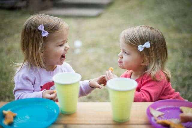 Little girls eating together.
