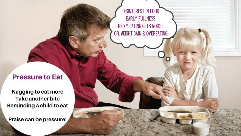 A man using pressure to eat with a child.