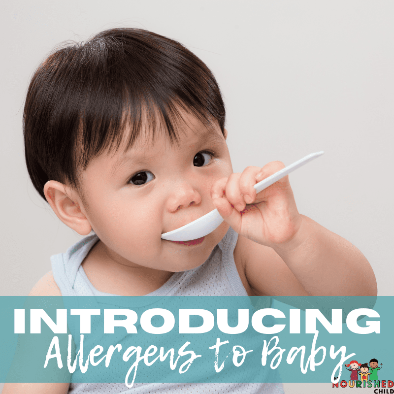 Baby eating off a spoon. Introducing allergens to baby - what you need to know