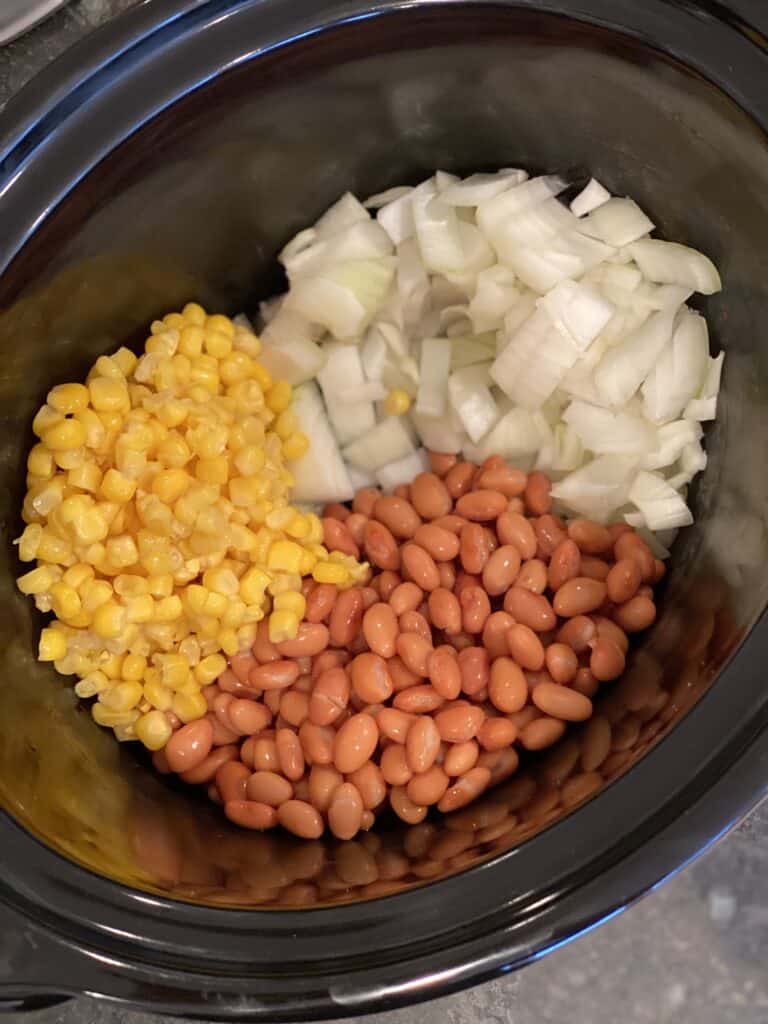 Pinto beans, chopped onion and canned corn are ingredients in my easy and healthy turkey chili in the crock pot