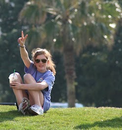 girl raising her arm with a peace sign