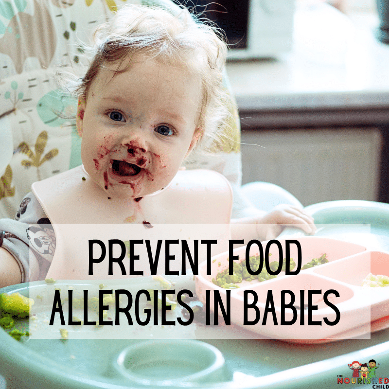 Baby in high chair eating broccoli, berries and eggs.